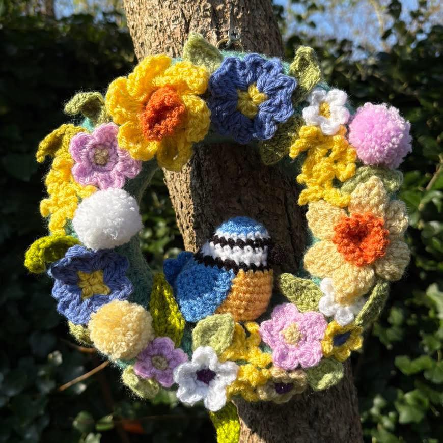 Spring Craft 2026. Item 155. Stunning springtime wreath, crochet and pompoms, daffs, spring flowers and a superb little bluetit.